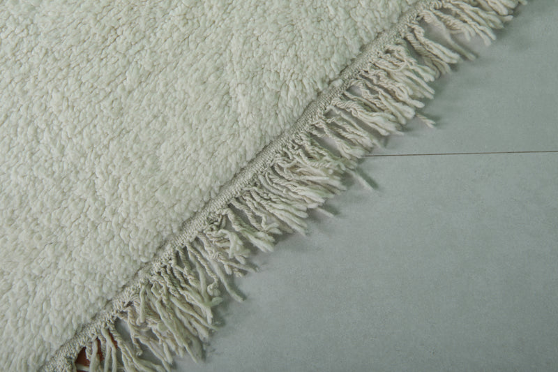 Minimalist Moroccan Rug - 6.3 x 9.6 ft | Soft White with Fringe