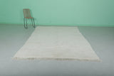 Minimalist Moroccan Rug - 6.5 x 9.7 ft | Soft White Shag with Fringe