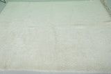 Minimalist Moroccan Rug - 6.7 x 9.8 ft | Soft White with Fringe