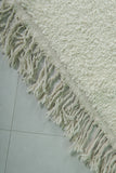 Minimalist Moroccan Rug - 6.7 x 9.8 ft | Soft White with Fringe