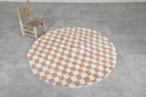 Round moroccan rug - feet beige rug