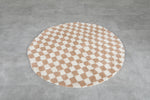 Round moroccan rug - feet beige rug