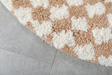 Round moroccan rug - feet beige rug