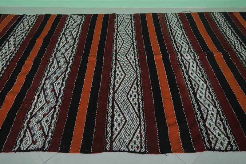 Moroccan Rug - Black, Orange, and White Striped Design - 5.5x9.6 ft