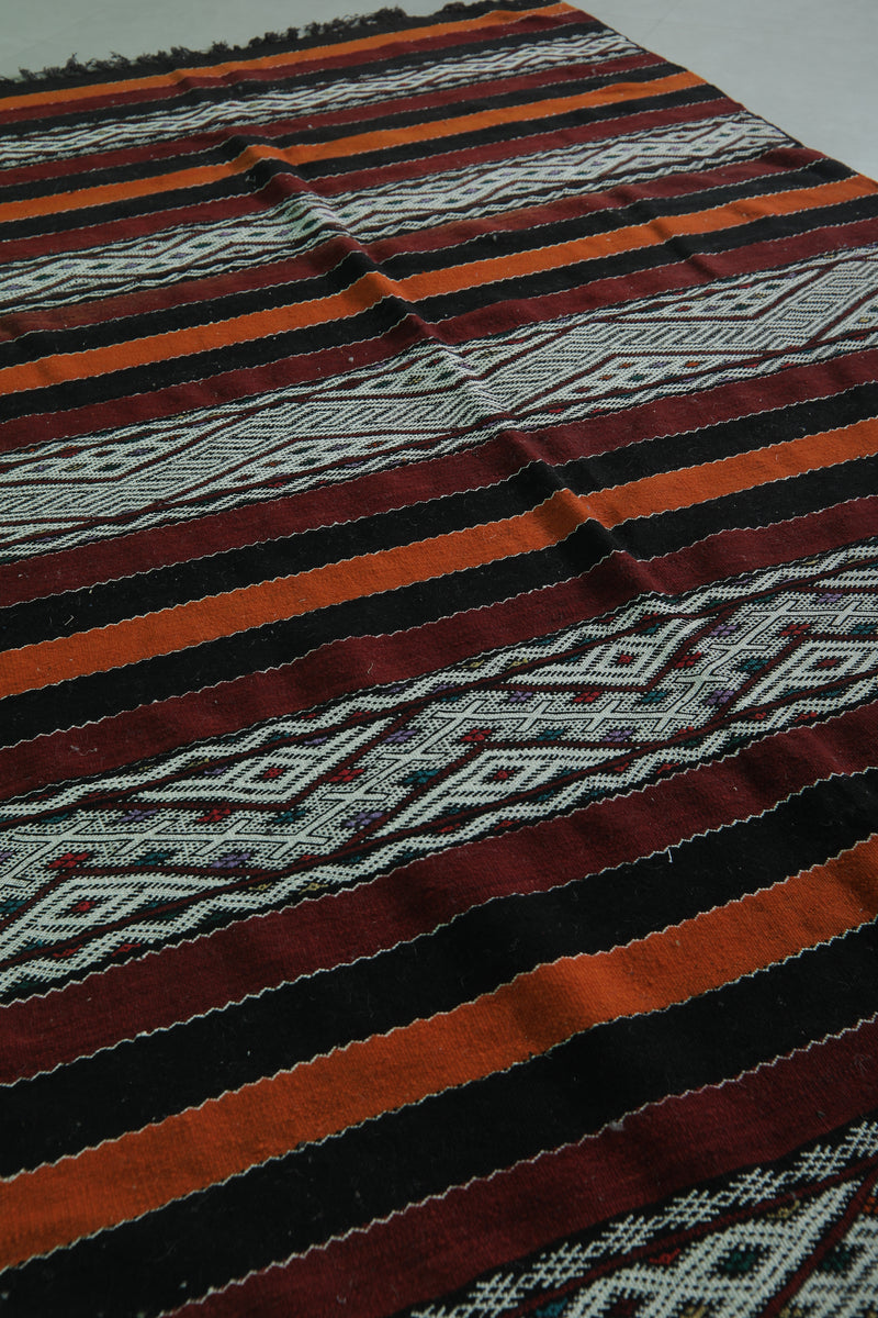 Moroccan Rug - Black, Orange, and White Striped Design - 5.5x9.6 ft